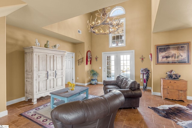 4101 Abbeville Hwy, Anderson, SC 29624 - living room featuring visible vents, a towering ceiling, and baseboards