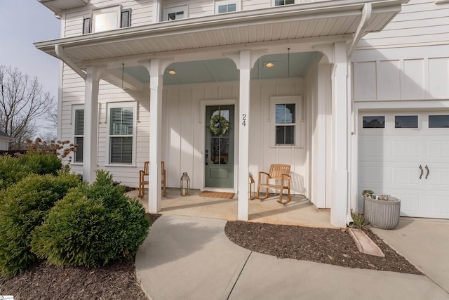 property entrance with covered porch and board and batten siding