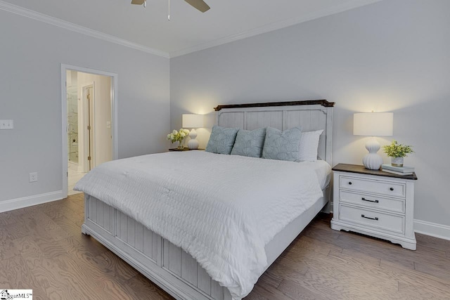 bedroom featuring dark wood-style floors, ensuite bathroom, ornamental molding, ceiling fan, and baseboards