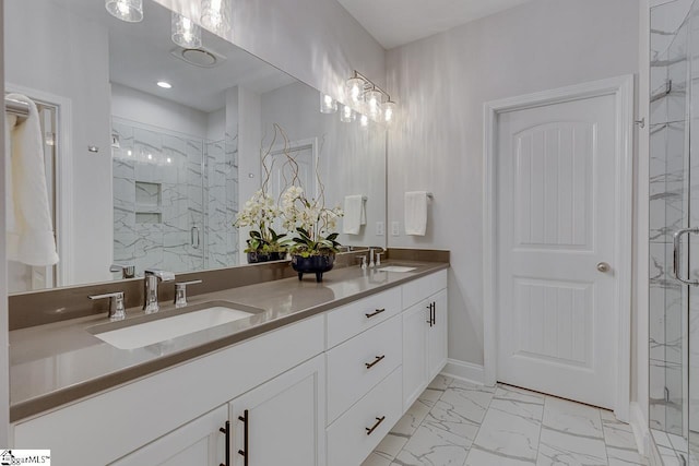 bathroom with marble finish floor, double vanity, a sink, and a marble finish shower