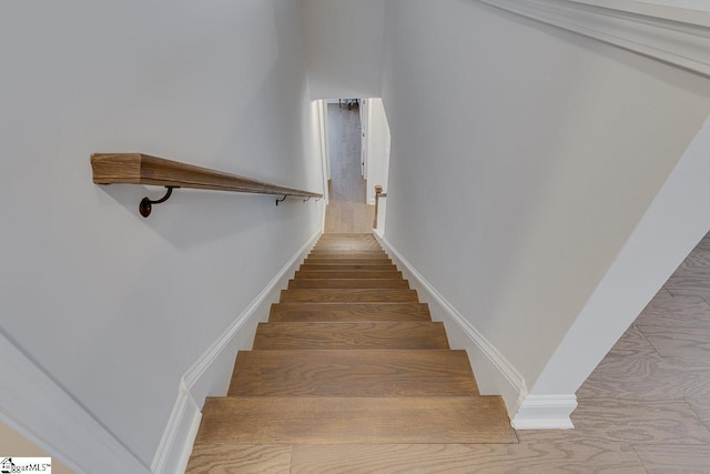 stairs featuring baseboards