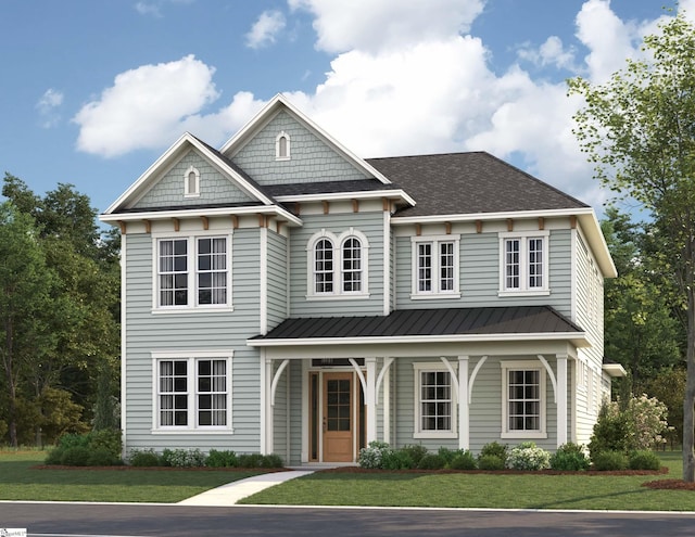 view of front of home featuring a standing seam roof, covered porch, metal roof, and a front lawn