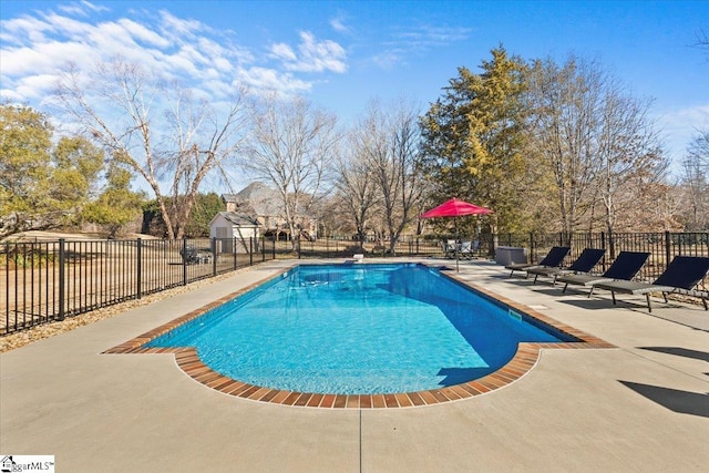 view of pool with a patio area, fence, and a fenced in pool