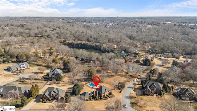 aerial view with a wooded view