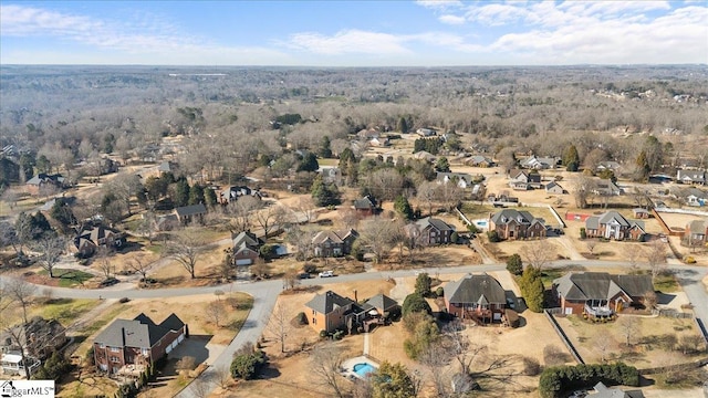 birds eye view of property with a residential view and a forest view