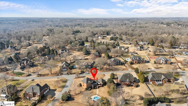 aerial view with a residential view and a wooded view