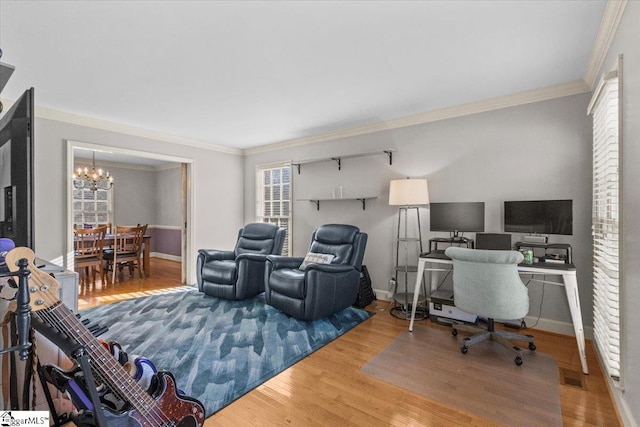 home office featuring a chandelier, crown molding, baseboards, and wood finished floors