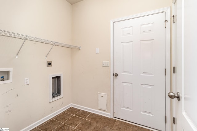 laundry room featuring laundry area, baseboards, dark tile patterned flooring, hookup for a washing machine, and hookup for an electric dryer