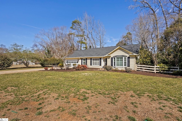 ranch-style home with fence and a front lawn