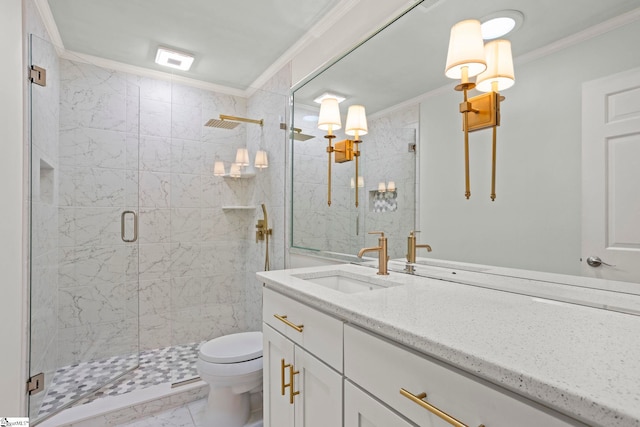 full bathroom with a stall shower, toilet, marble finish floor, crown molding, and vanity