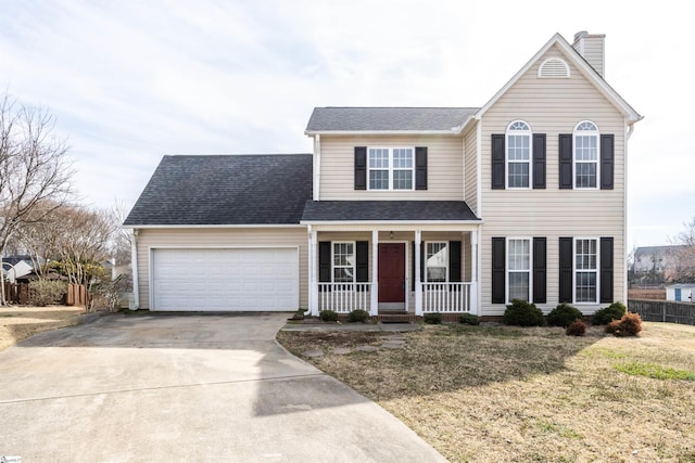 traditional-style home featuring a chimney, a porch, concrete driveway, an attached garage, and fence