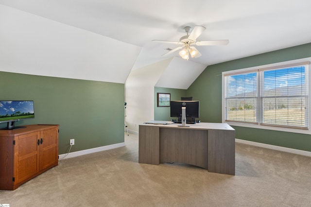 office area featuring lofted ceiling, light carpet, ceiling fan, and baseboards