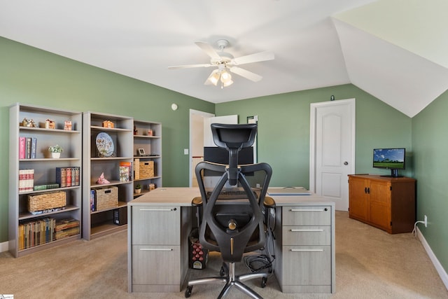 office area with light colored carpet, vaulted ceiling, baseboards, and ceiling fan