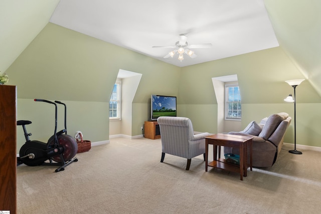 living area featuring baseboards, carpet, and a healthy amount of sunlight