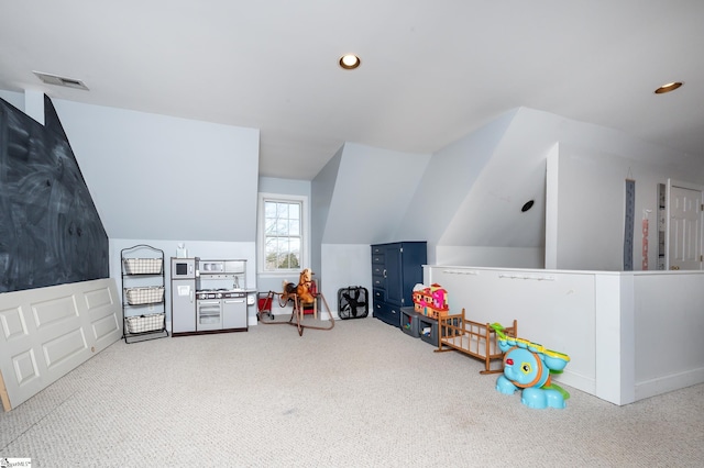 rec room with lofted ceiling, carpet flooring, visible vents, and recessed lighting