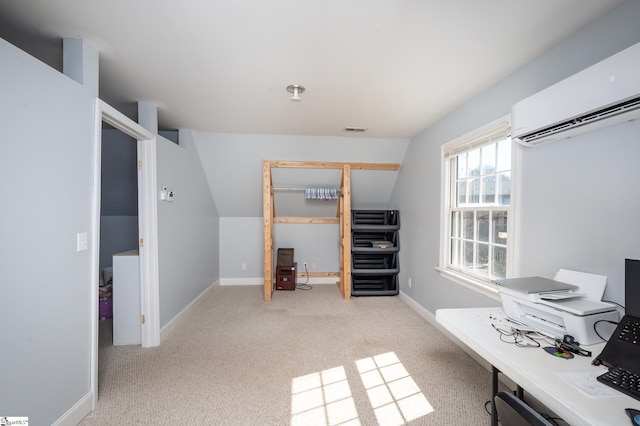 carpeted home office featuring visible vents, baseboards, and a wall mounted AC