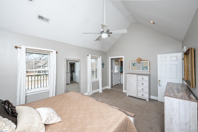 bedroom with baseboards, visible vents, light colored carpet, ceiling fan, and high vaulted ceiling