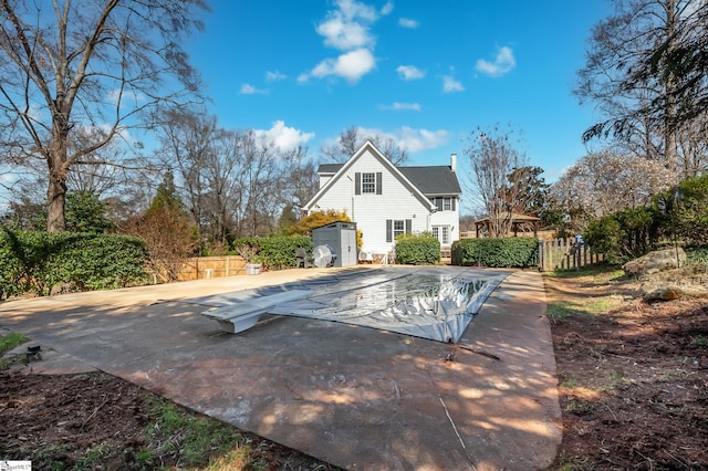 view of swimming pool featuring fence private yard