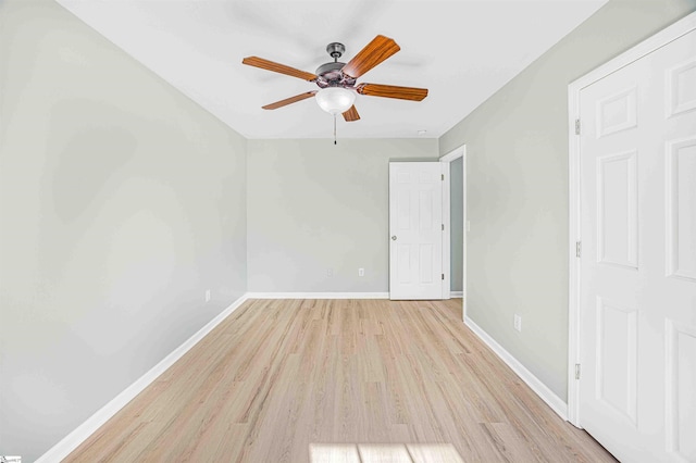 unfurnished bedroom with baseboards, ceiling fan, and light wood-style floors