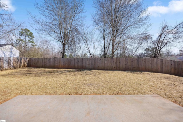 view of yard with a fenced backyard and a patio