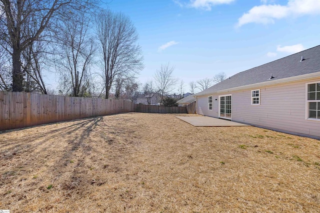 view of yard with a fenced backyard and a patio