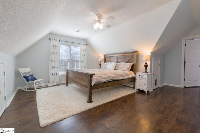 bedroom featuring vaulted ceiling, ceiling fan, dark wood-style flooring, and baseboards