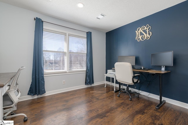 office space featuring a textured ceiling, wood finished floors, and baseboards