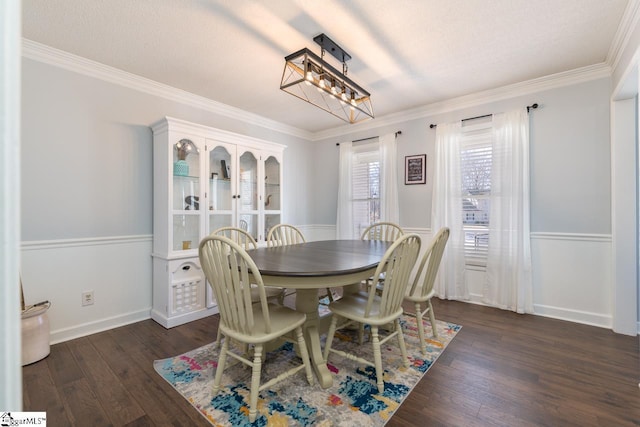 dining area with crown molding, a textured ceiling, baseboards, and dark wood-type flooring