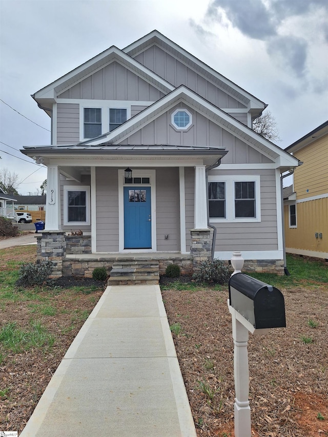 view of front of house featuring covered porch and board and batten siding