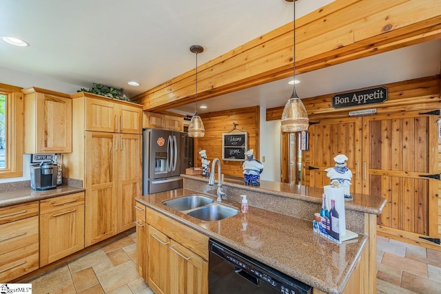 kitchen featuring black dishwasher, stone tile floors, a sink, an island with sink, and stainless steel fridge with ice dispenser