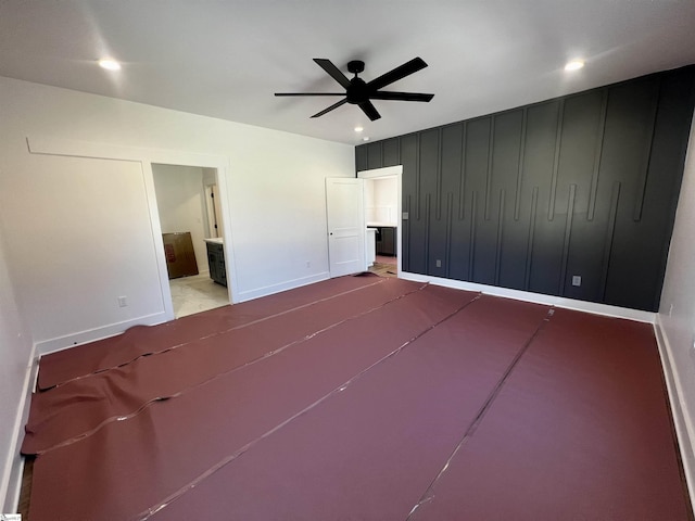 unfurnished bedroom featuring recessed lighting, baseboards, and ensuite bath