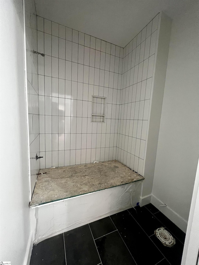 bathroom featuring tile patterned flooring and baseboards