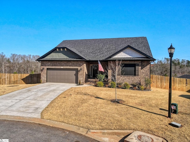 view of front of property with brick siding, concrete driveway, an attached garage, fence, and a front lawn