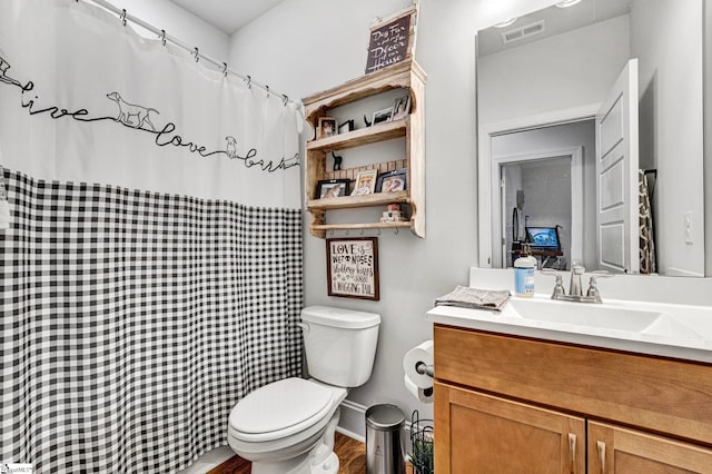 full bath with a shower with shower curtain, visible vents, vanity, and toilet