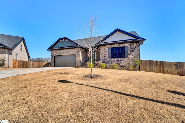 view of front of home featuring a garage, brick siding, fence, driveway, and a front lawn