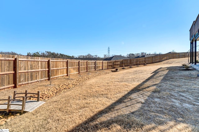 view of yard with a fenced backyard