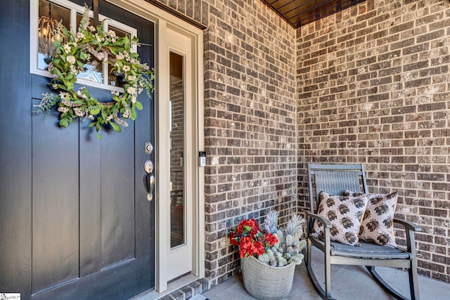 entrance to property with brick siding