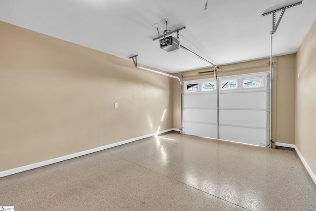 garage featuring baseboards and a garage door opener