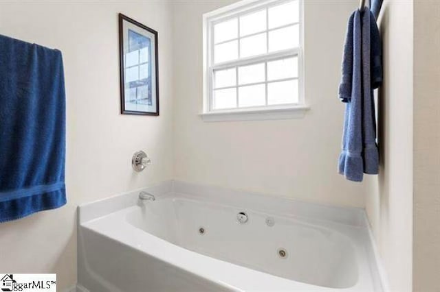 bathroom with a jetted tub