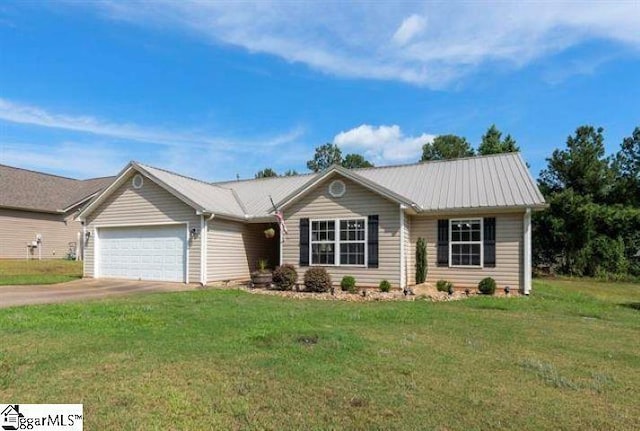 single story home with an attached garage, driveway, metal roof, and a front yard