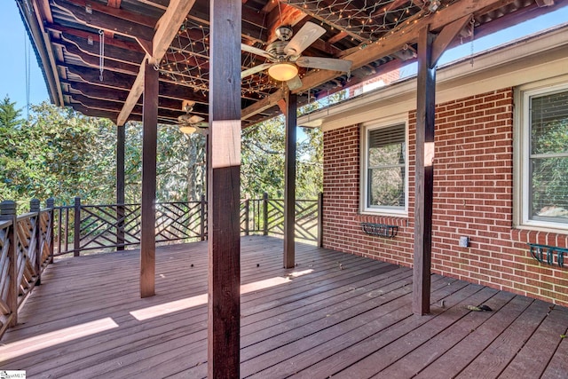 wooden deck featuring a ceiling fan