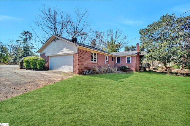 view of front of home featuring a garage, brick siding, concrete driveway, a chimney, and a front yard