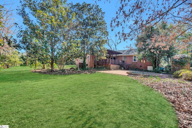 view of yard featuring a deck