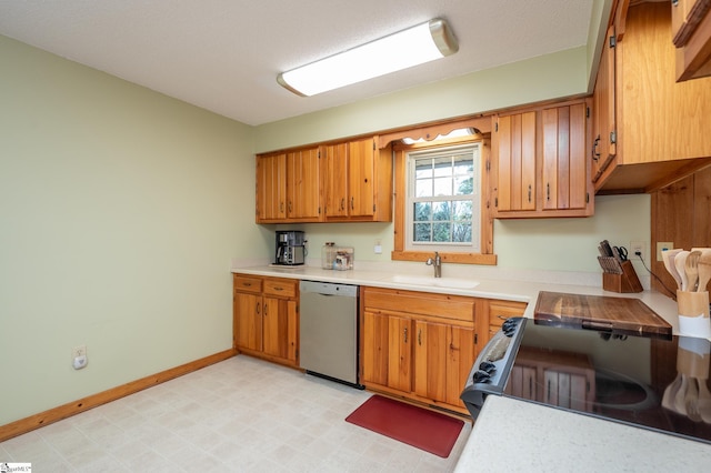 kitchen featuring stainless steel dishwasher, light countertops, black electric range, light floors, and a sink