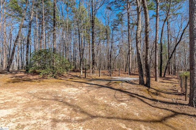 view of yard featuring a view of trees