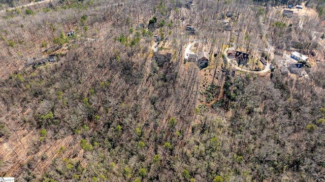 bird's eye view featuring a view of trees