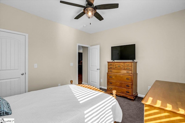 bedroom featuring baseboards, a ceiling fan, and dark carpet