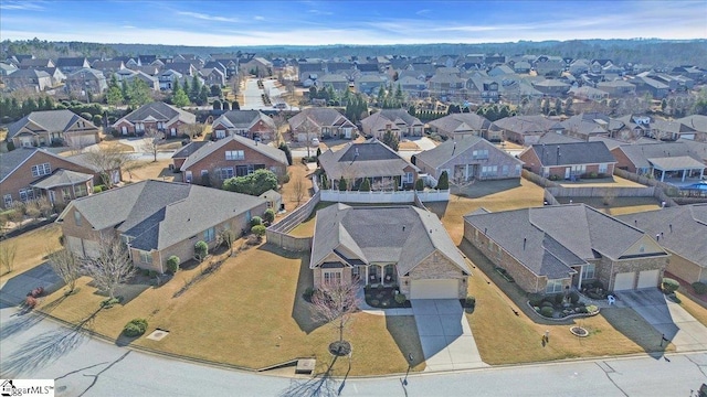 birds eye view of property with a residential view