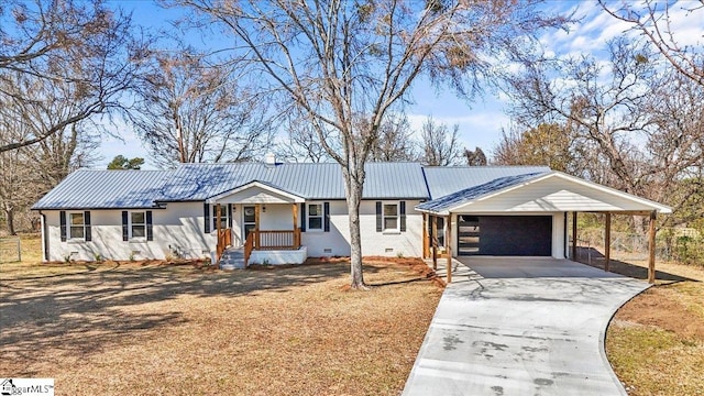 ranch-style house with metal roof, a garage, concrete driveway, crawl space, and a carport