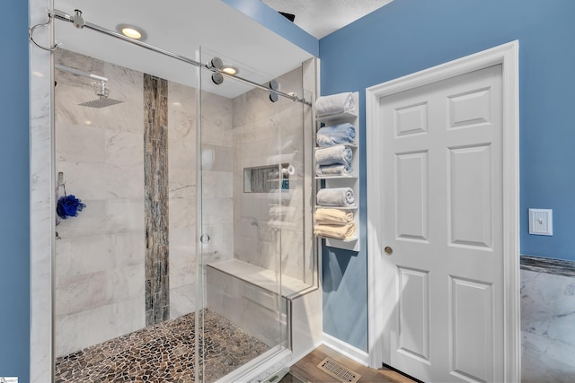 full bath with a shower stall